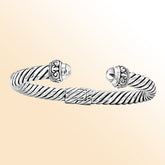Handcrafted sterling silver cable cuff Bangwith ornate dome ends in Bali artisan design"e
